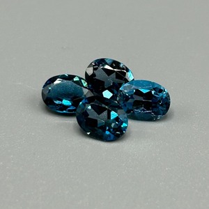 lot 34 image: 5.88 Carat London Blue Topaz Faceted Oval Cut - Set of 4 Loose Stones