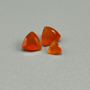 lot 43 image: 1.70 Carat Fire Opal Faceted Triangular Cut - Various Size Set of 3 Loose Stones
