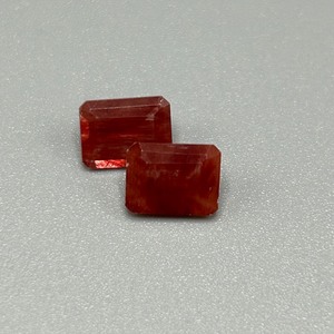 lot 56 image: 2.48 Carat Red Stone Faceted Rectangular Emerald Cut - Set of 2 Loose Stones