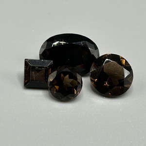 lot 200 image: 11.81 Carat Smoky Quartz Faceted Mixed Cut - Various Size, Hue & Shape Set of 4 Loose Stones
