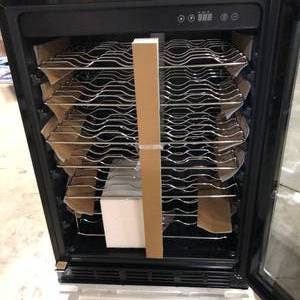lot 24 image: Magic Chef 23.4 in. W 50-Bottle Wine Cooler in Stainless Steel  Customer Returns See Pictures