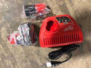 lot 23 image: Milwaukee M12 12-Volt Lithium-Ion 4.0 Ah and 2.0 Ah Battery Packs and Charger Starter Kit Customer Returns See Pictures