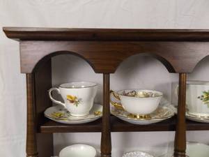 lot 22 image: Lot of 16 Vintage Teacups and Saucers on Wood Display