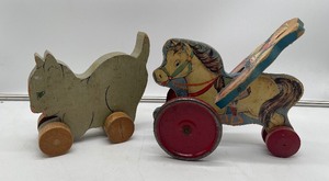 lot 115 image: Vintage Wood Cowboy Horse Pull Toy Hill Bass Co. Metal Wheels