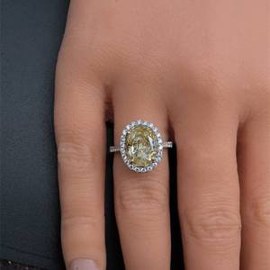 5.09 Carat Natural Fancy Yellow Diamond & White Diamond Oval Halo Ring in 18k Gold - $64,225 Appraisal Included