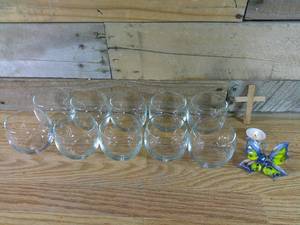 lot 145 image: Set of 10 Glass Punch Glasses, 1 Small Wooden Cross, Candle, & Blown Glass Butterfly