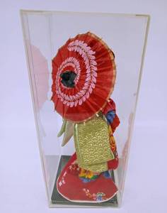 lot 27 image: Vintage Geisha Doll Holding an Umbrella with Lucite Display Case