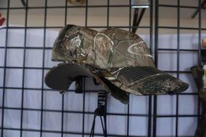 lot 125 image: Mesh Back Pack With 5 Real Tree Camo Baseball Caps