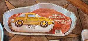 lot 37 image: Vintage Wilton Cake Pans Sports Car, Flag, Clown & Horseshoe