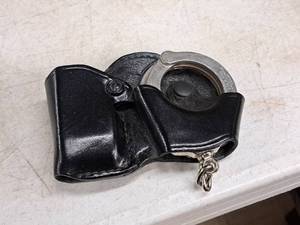 lot 204 image: Gould & Goodrich Hand Cuffs with Holder