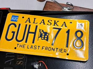 lot 54 image: License Plate - Alaska 2015 GUH718