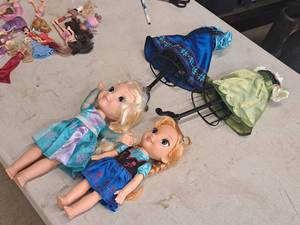 lot 189 image: Lot of (2) Dolls with Clothes Racks and Extra Outfits