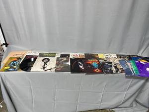 Lot of Vinyl Records Including Def Leppard  Boston  2001 A Space Odyssey  Run DMC  Carpenters  Kiss  And Many More