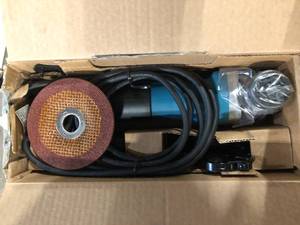 lot 44 image: 7.5 Amp Corded 4-12 in. Easy Wheel Change Compact Angle Grinder with Grinding Wheel, Wheel Guard and Side Handle  Customer Returns See Pictures