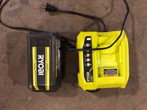 lot 32 image: RYOBI  Battery and Charger  Customer Returns See Pictures