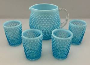 lot 28 image: Unmarked Vintage Fenton Blue Opalescent Glass Pitcher And 4 Drinking Glasses, Hobnail Pattern Glass. Glasses Are 3 14T The Pitcher Is 5 14T