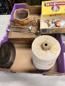 Roll of string, small cast iron pan