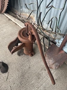 Yard Art and hand water pump
