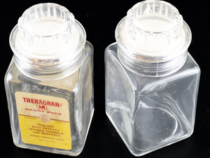 lot 326 image: Set of 2 - Vintage Theragran-M Vitamin Glass Bottle Jar