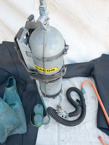 lot 31 image: VINTAGE DACOR Scuba tank with 2 Stage Regulator & Rubber Wetsuit and other accessories