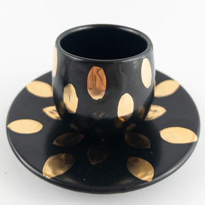 lot 406 image: 4 Piece Set of ITALIAN Black with Gold Glaze Cup and Saucer, Table Lighter and Underplate