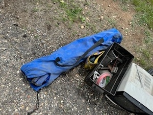lot 53 image: Garage Items - Tarp, Aluminum Wire, Jack Handles and More