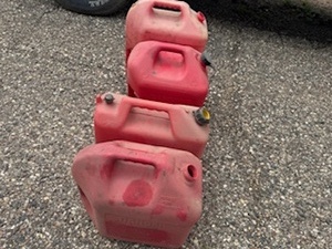 lot 9 image: Two Five-Gallon and Two Six-Gallon Gas Cans