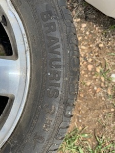 lot 20 image: Five Bolt Chevy Rim and Tire 205-65-R16H