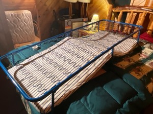 lot 23 image: fold up cot- used