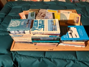 lot 31 image: collection of books- up north, wildernessl,nautical
