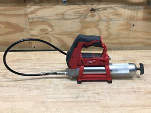 lot 54 image: Used Milwaukee M12 Cordless LITHIUM-ION Grease Gun Model # 2446-20 (Tested And Works) (Tool Only)