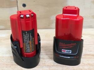 lot 99 image: Lot of 2 - New Milwaukee M12 REDLITHIUM CP2.0 AH Batteries Model # 48-11-2420 05222411
