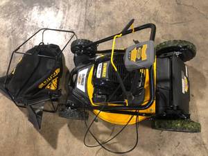 lot 5 image: DEWALT 21 in. 163cc Briggs and Stratton 725Exi Engine Rear Wheel Drive 3-in-1 Gas Self Propelled Walk Behind Lawn Mower Used Not Checked Customer Returns See Pictures