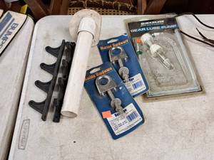 lot 391 image: Bow Eye Bolts, Gear Lube Pump, Fishing Pole Holder
