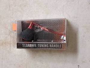 lot 464 image: Lot of (1) Seahawk Tuning Handle Custom Fishing Reel Handle (in original packaging)