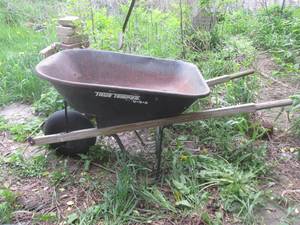 (OUT) Black Wheelbarrow - Tire Has ...
