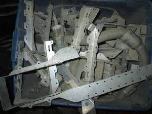 lot 89 image: Tote of metal framing brackets and supplies