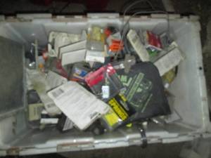 lot 110 image: High value tote of assorted automotive parts and supplies including an inflatable pry bar & leveling tool