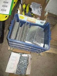 lot 126 image: Heavy metal construction bracket plates, roofing nails, ratchet straps and more