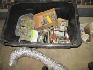lot 175 image: Heavy duty tote loaded with an assortment of construction hardware (nails, screws and more)
