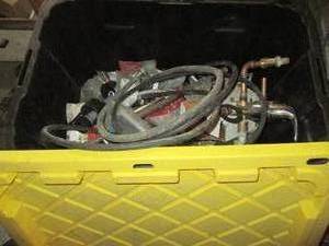 lot 185 image: Tote of plumbing supplies and accessories