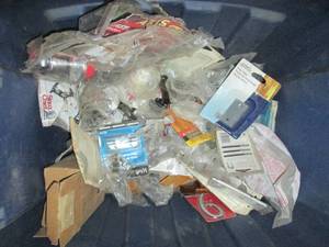 lot 187 image: Tote of assorted new door hardware and other home improvement supplies