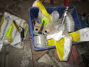 lot 217 image: Tote containing a large assortment of plumbing hoses and supplies plus flexible dryer ventilation supplies