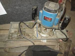 lot 218 image: Heavy duty Ryobi 3hp router with affixed metal plate