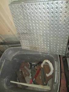 lot 219 image: Heavy duty hoist style hook, diamond plate type pegboard squares and other Misc with tote