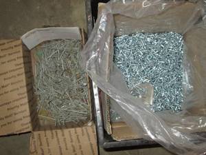 lot 239 image: Milk crate of misc construction nails and hardware