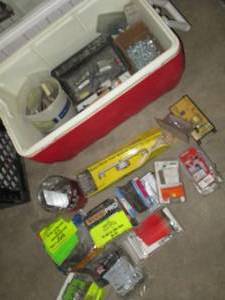 lot 240 image: Igloo cooler with large assortment of construction hardware and supplies