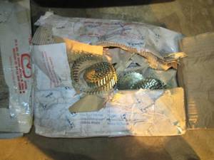 lot 257 image: Open case of coil roofing nails
