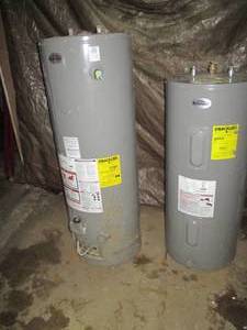 lot 6 image: Richmond 55-gallon Electric and Richmond 48-gallon gas Water heaters UNTESTED. FUNCTIONALITY NOT KNOWN