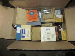 lot 9 image: Box of misc automotive parts including CV Boots, Rocker shaft supports, starter drive assembly and more